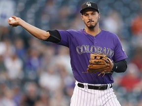 In this Sept. 12, 2018, file photo, Colorado Rockies third baseman Nolan Arenado throws to first base during a game in Denver. (AP Photo/David Zalubowski, File)