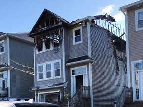 The aftermath of a house fire is seen in the Spryfield community in Halifax on Tuesday, Feb. 19, 2019.