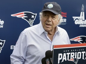 In this June 7, 2018, file photo, New England Patriots owner Robert Kraft speaks with reporters following a minicamp practice, in Foxborough, Mass.