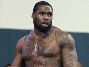 In this March 16, 2016, file photo, Shawn Oakman pauses during drills for NFL scouts at Baylor's Pro Day football workout in Waco, Texas.