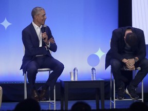 Golden State Warriors basketball player Stephen Curry, right, laughs while former President Barack Obama, speaks at the My Brother's Keeper Alliance Summit in Oakland, Calif., Tuesday, Feb. 19, 2019.