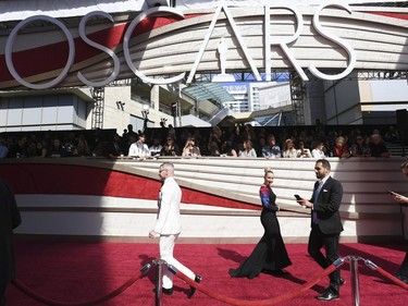 Media walk on the red carpet before the Oscars on Sunday, Feb. 24, 2019, at the Dolby Theatre in Los Angeles. (Jordan Strauss/Invision/AP)