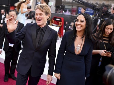 Willem DaFoe, left, and Giada Colagrande arrive at the Oscars on Sunday, Feb. 24, 2019, at the Dolby Theatre in Los Angeles. (Charles Sykes/Invision/AP)