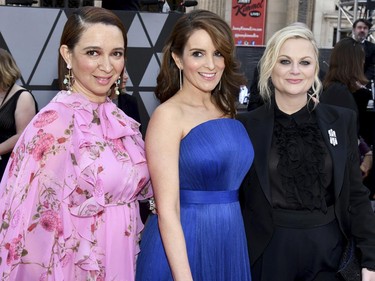 Maya Rudolph, from left, Tina Fey and Amy Poehler arrive at the Oscars on Sunday, Feb. 24, 2019, at the Dolby Theatre in Los Angeles. (Charles Sykes/Invision/AP)