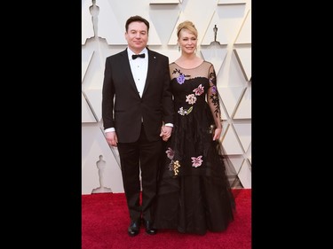 Mike Myers, left, and Kelly Tisdale arrive at the Oscars on Sunday, Feb. 24, 2019, at the Dolby Theatre in Los Angeles. (Richard Shotwell/Invision/AP)
