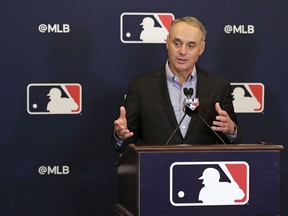 Rob Manfred, commissioner of Major League Baseball, speaks during a news conference at owners meetings Friday, Feb. 8, 2019, in Orlando, Fla.