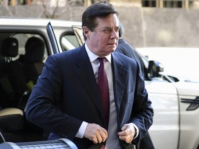 In this Dec. 11, 2017, file photo, former Trump campaign chairman Paul Manafort arrives at federal court in Washington. (AP Photo/Susan Walsh, File)