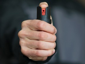 Man holding pepper spray. (Getty Images)