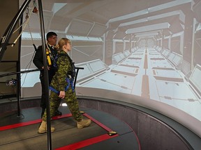 Col. Rakesh Jetly (chief pyschiatrist, Canadian Armed Forces) demonstrates the 3MDR system with Capt. Anna Harpe at Glenrose Rehabilitation Hospital in Edmonton on Wednesday Feb. 13, 2019.