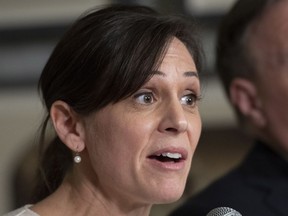 Quebec Junior Education Minister and newly nominated as responsible for the Status of Women portfolio Isabelle Charest responds to reporters at a news conference, Tuesday, February 5, 2019 at the legislature in Quebec City.