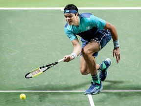 Canadian Milos Raonic tries to return the ball to Swiss Stan Wawrinka during their match on day three of the ABN AMRO World Tennis Tournament in Rotterdam on February 13, 2019. (KOEN VAN WEEL/AFP/Getty Images)