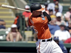 Baltimore Orioles' Caleb Joseph hits a two-run single off Tampa Bay Rays relief pitcher Colton Murray during the fifth inning of a spring training baseball game Friday, March 23, 2018, in Sarasota, Fla.