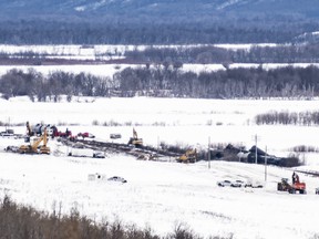 Excavators work at the site of a train derailment ten-kilometres south of St. Lazare, Man. on Saturday February 16, 2019. (THE CANADIAN PRESS/Michael Bell)