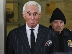 In this Feb. 1, 2019 photo, former campaign adviser for President Donald Trump, Roger Stone, leaves federal court in Washington. (AP Photo/Pablo Martinez Monsivais)