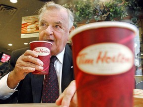 Ron Joyce, co-founder of Tim Hortons, sips a coffee in Toronto on Friday, Octo. 20, 2006.
