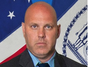 In this undated photo provided by the New York City Police Department, Det. Brian Simonsen is shown.