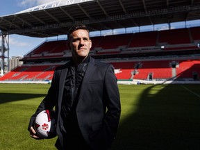 Canada men's national soccer team newly-announced coach John Herdman poses for a picture at BMO Field in Toronto, Monday, Feb. 26, 2018.