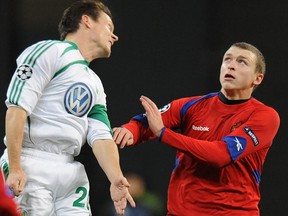 Pavel Mamaev (right) of CSKA Moskva vies with Sascha Riether of WfL Wolfsburg during their Champions League match in Moscow on November 25, 2009. (YURI KADOBNOV/AFP/Getty Images)