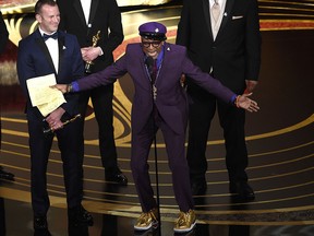 Charlie Wachtel, left, and Spike Lee accept the award for best adapted screenplay for "BlacKkKlansman" at the Oscars on Sunday, Feb. 24, 2019, at the Dolby Theatre in Los Angeles. (Chris Pizzello/Invision/AP)