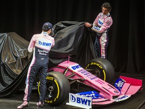 Drivers Lance Stroll (right) and Sergio Perez unveil the new SportPesa Racing Point F1 Team race car at the at the Metro Toronto Convention Centre in Toronto on Wednesday, February 13, 2019. (Ernest Doroszuk/Toronto Sun)