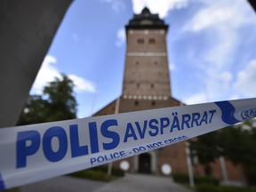 In this file photo dated Tuesday, July 31, 2018, a police cordon near the scene of a robbery at the Strangnas Cathedral, in Strangnas, Sweden, after priceless treasures from the Swedish royal regalia were stolen. (Pontus Stenberg/TT News Agency FILE via AP)