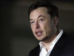 In this June 14, 2018, file photo, Tesla CEO Elon Musk speaks at a news conference in Chicago. Stock market regulators are asking a federal court to hold Musk in contempt for violating an agreement requiring him to have his tweets about key company information reviewed for potentially misleading claims. The request made Monday, Feb. 25, 2019 in New York resurrects a dispute between the Securities and Exchange Commission and Musk that was supposed to have been resolved with a settlement reached five months ago.