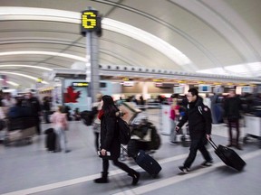 Bustling travellers at Pearson International Airport.