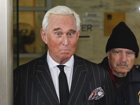 In this Feb. 1, 2019 file photo, former campaign adviser for President Donald Trump, Roger Stone, leaves federal court in Washington.