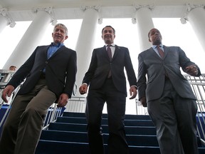 In this Jan. 12, 2018 file photo, Virginia Gov.-elect, Lt. Gov Ralph Northam, centre, walks down the reviewing stand with Lt. Gov-elect, Justin Fairfax, right, and Attorney General Mark Herring at the Capitol in Richmond, Va.