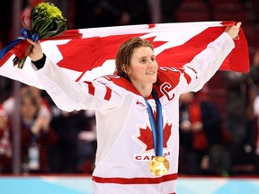 Canada's Hayley Wickenheiser celebrates after defeating the USA during the women's final ice hockey game at the Vancouver 2010 Olympics in Vancouver, Thursday Feb. 25, 2010.