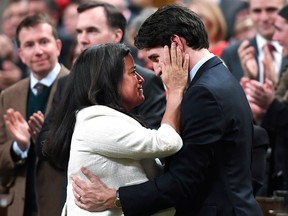 Prime Minister Justin Trudeau is embraced by Minister of Justice and Attorney General of Canada Jody Wilson-Raybould after delivering a speech on the recognition and implementation of Indigenous rights in in the House of Commons on Parliament Hill in Ottawa on Wednesday, Feb. 14, 2018.