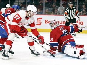 Montreal Canadiens' Carey Price stretches out his pad to stop shot by Detroit Red Wings Michael Rasmussen during second period of National Hockey League game in Montreal Tuesday, March 12, 2019.