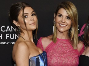 In this Feb. 28, 2019 file photo, actress Lori Loughlin poses with her daughter Olivia Jade Giannulli, left, at the 2019 "An Unforgettable Evening" in Beverly Hills, Calif.