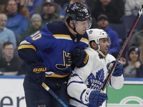 St. Louis Blues' Brayden Schenn collides with Toronto Maple Leafs' Nazem Kadri during a game last month. (AP PHOTO)