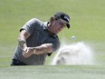 Phil Mickelson hits out of a bunker onto the second green during the first round of the Arnold Palmer Invitational on Thursday. (AP PHOTO)