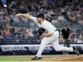 Adam Warren of the New York Yankees delivers a pitch in the sixth inning against the Kansas City Royals at Yankee Stadium on July 26, 2018 in the Bronx borough of New York City.