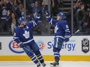 Mitch Marner (right) needs 10 points in the Maple Leafs’ final six games to get to 100, while teammate John Tavares needs five goals to get to the 50 mark.  Getty Images