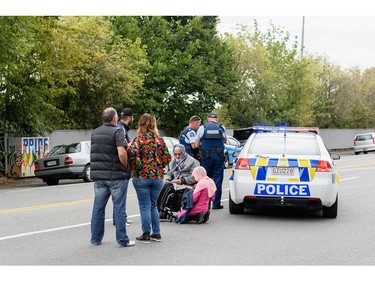 Members of the public react in front of the Masjd Al Noor Mosque as they fear for their relatives on March 15, 2019 in Christchurch, New Zealand.