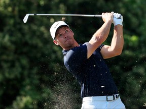 Paul Casey of England plays his shot from the 13th tee during the final round of the Valspar Championship on the Copperhead course at Innisbrook Golf Resort on March 24, 2019 in Palm Harbor, Fla. (Cliff Hawkins/Getty Images)