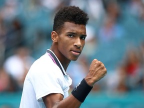 Felix Auger-Aliassime of Canada reacts against John Isner of USA in the semi final during day twelve of the Miami Open tennis on March 29, 2019 in Miami Gardens, Florida.