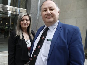 Catherine Petrolo stands with her representative Frank Alfano outside the Law Society of Ontario tribunal office, on University Ave., as she is fighting her temporary suspension of her paralegal licence on Friday, March 22, 2019.