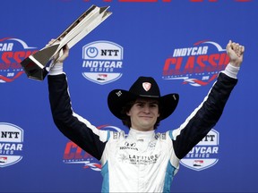 Colton Herta celebrates his win in the IndyCar Classic auto race Sunday, March 24, 2019, in Austin, Texas. (AP Photo/Eric Gay)