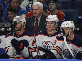 Edmonton Oilers head coach Ken Hitchcock, top centre, looks on during the third period of an NHL hockey game against the Buffalo Sabres, Monday, March 4, 2019, in Buffalo N.Y. (AP Photo/Jeffrey T. Barnes)