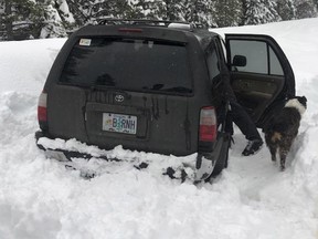 This photo released Saturday, March 2, 2019, by the Deschutes County Sheriff's Office, shows the scene where a man whose car was stranded in central Oregon snow for 5 days survived by eating taco sauce packets and starting the engine periodically to warm up near Bend, Ore. (Deschutes County Sheriff's Office via AP)