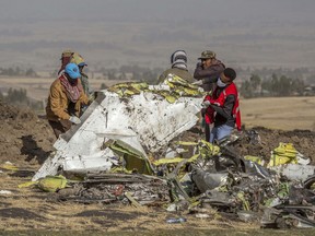 Rescuers work at the scene of an Ethiopian Airlines flight crash near Bishoftu, or Debre Zeit, south of Addis Ababa,  Ethiopia, Monday, March 11, 2019.