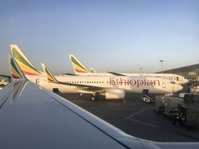 This photo taken Monday, Feb. 11, 2019 shows an Ethiopian Airlines Boeing 737-800 parked at Bole International Airport in Addis Ababa, Ethiopia.