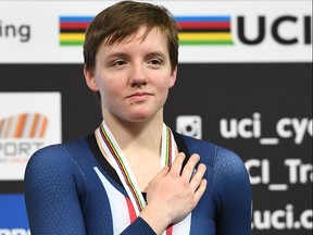 In this file photo taken on March 3, 2018, bronze medallist Kelly Catlin  poses on the podium after taking part in the women's individual pursuit final during the UCI Track Cycling World Championships in Apeldoorn. (EMMANUEL DUNAND/AFP/Getty Images)