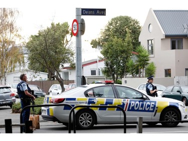 Police officers secure the area in front of the Masjid al Noor mosque after a shooting incident in Christchurch on March 15, 2019.