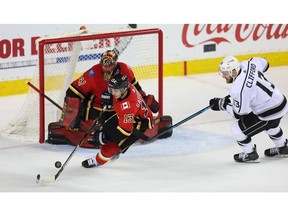Calgary Flames superstar Johnny Gaudreau on the back-check against Kyle Clifford of the Los Angeles Kings during NHL hockey at the Scotiabank Saddledome in Calgary on Monday, March 25, 2019.