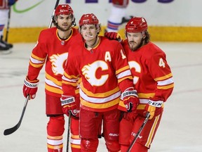 Calgary Flames Matthew Tkachuk celebrates with teammates after scoring against the New York Rangers in NHL hockey at the Scotiabank Saddledome in Calgary on Friday, March 15, 2019. Al Charest/Postmedia